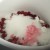 Adding sugar to the fruit in the pan