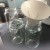 A scrubbed and sterilized old dishwasher salt filler works well as a funnel