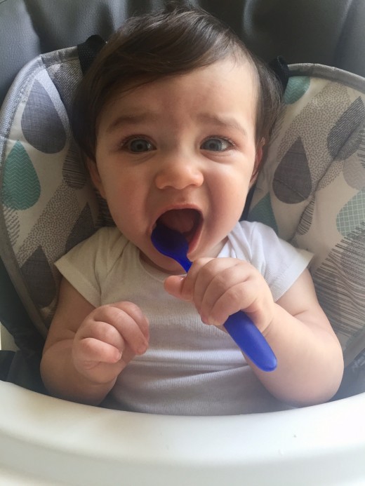 After eating some frozen fruits I let my guy hold the spoon and chew on it.