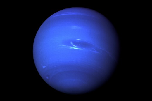 Neptune's most distinct feature is a giant 1280 kilometre-wide storm known as the Great Dark Spot. (Shown here in the middle)