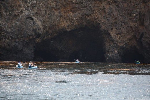 Kayakers entering one of about 130 sea caves on the Channel Islands.