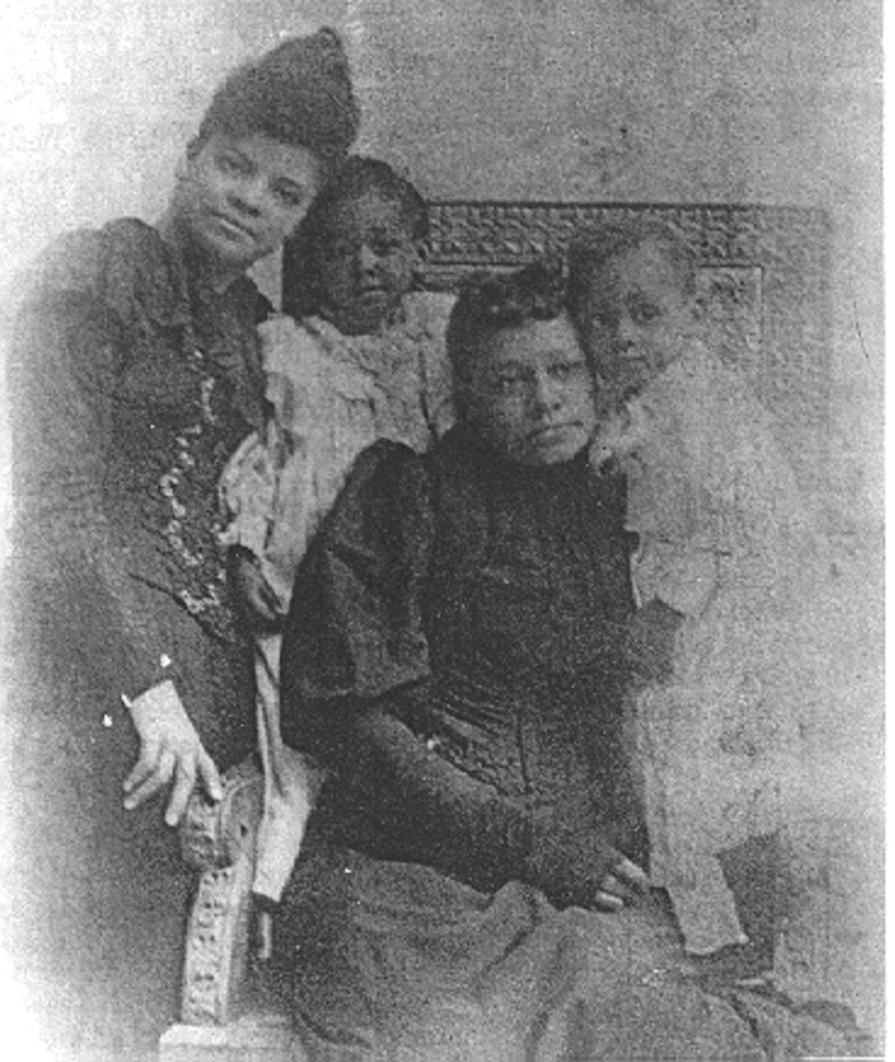 L to R: Ida B. Wells, Maureen Moss, Mrs. Betty Moss, and Tom Moss, Jr., taken about two years after the lynching.