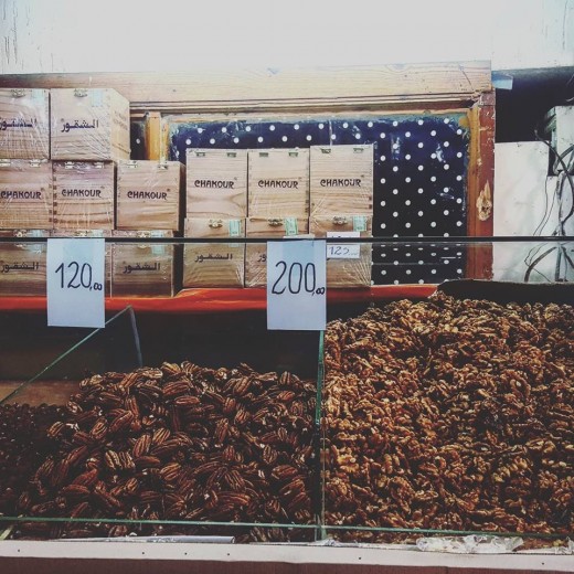 Kilos of walnuts from Demnate, Morocco, line the shelves of the shop.