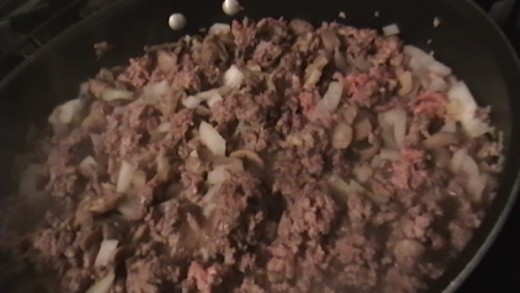 Add chopped onion to ground beef.
