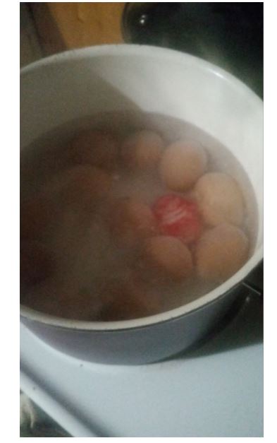 Bring to boil. The red object is an egg timer.