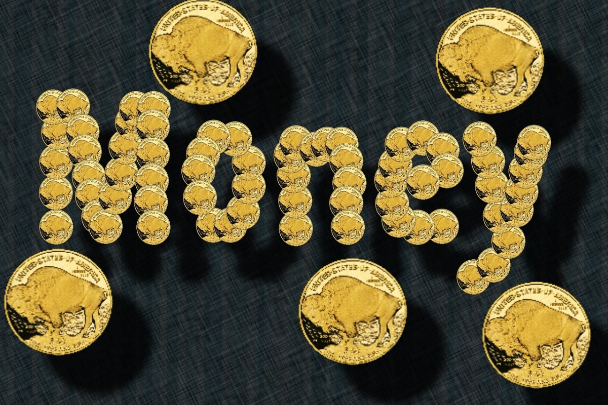 A sign spelling money with gold -plated Buffalo nickels and surrounded by scattered gold coins. 