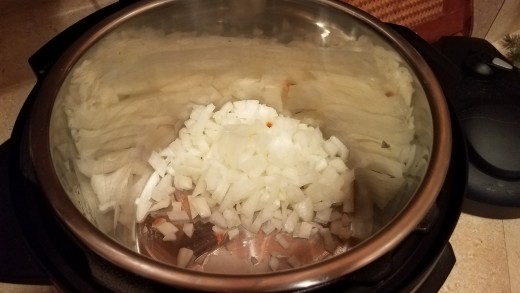 Start by melting some coconut oil in your pot and chopping and sauteing your onions until transparent.