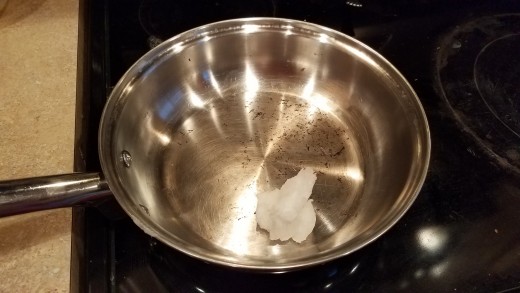 Melt your coconut oil in a large saute pan.