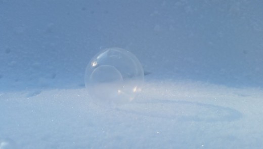 See. Success. A bubble has gently perched upon the snow and has not popped.