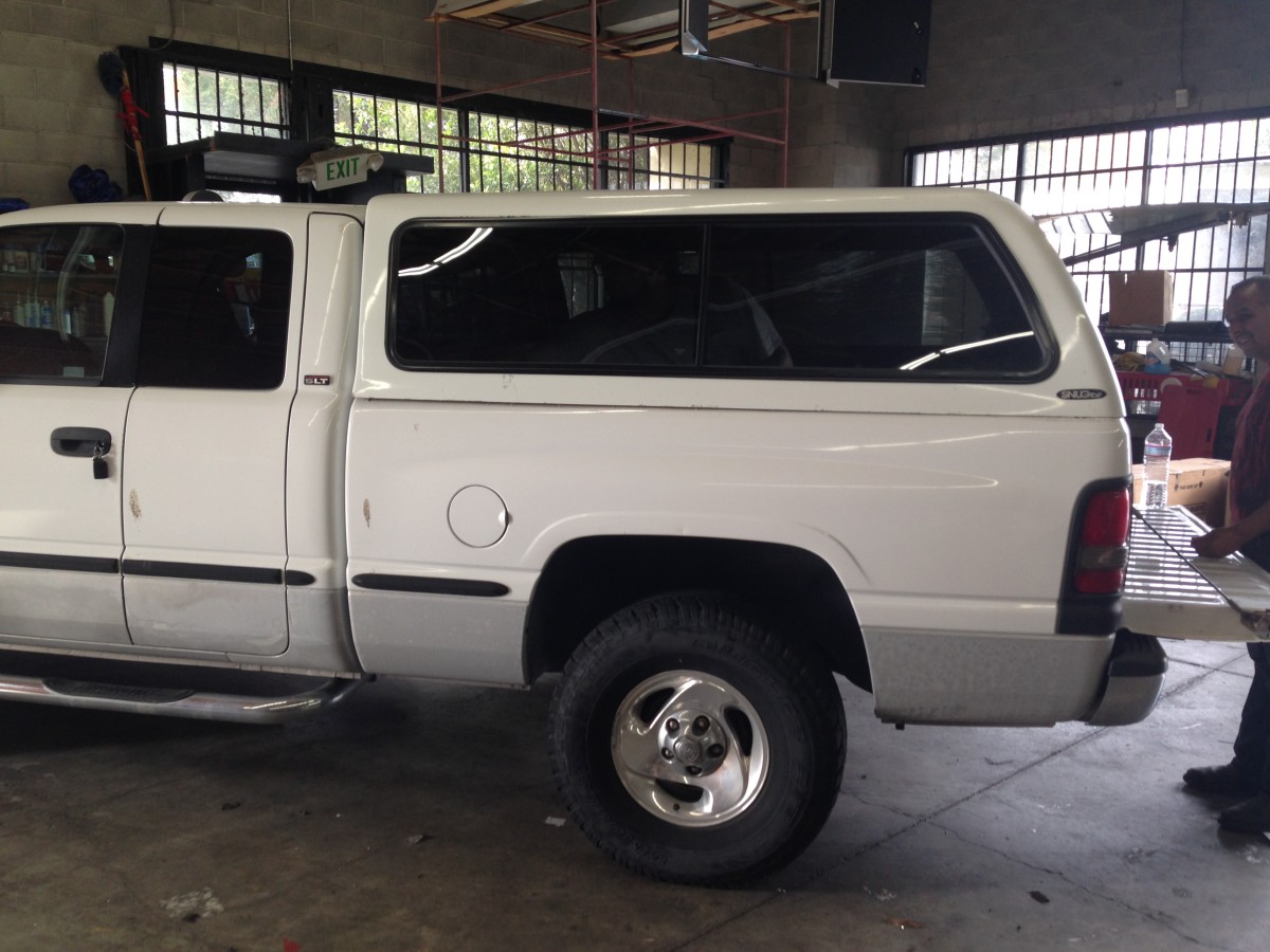 Buying a Used Camper Shell: Tips and Compatibility Info | AxleAddict 2004 Dodge Dakota Quad Cab Camper Shell
