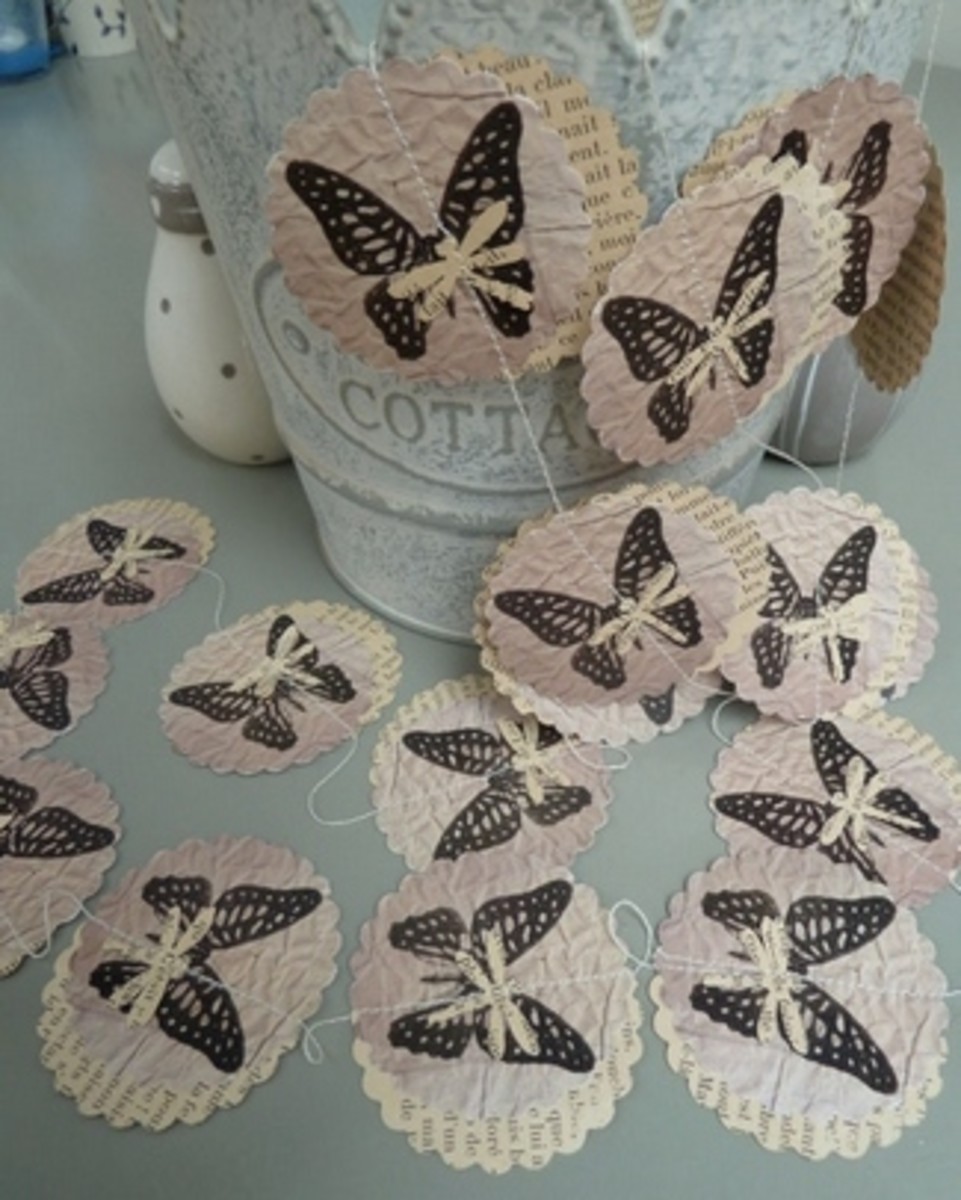 A butterfly garland makes perfect sense as a background for your butterfly wedding. Punched from old books and stamped makes a vintage look. This is so easy to make and makes a lovely backdrop for your wedding ceremony or as a photo booth background