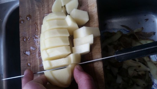 slice across long way, turn potato and hold while you cross cut.
