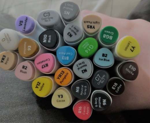 I have supplemented my marker collection with four Copics and four Prismacolor markers. I plan to get a bright red Prismacolor soon, too.