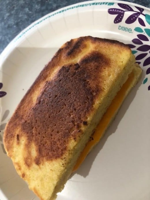 Easy to make Keto bread takes 90 seconds in a microwave. Cut in half and you can use it to make a thick, 1/2 grilled cheese sandwich!