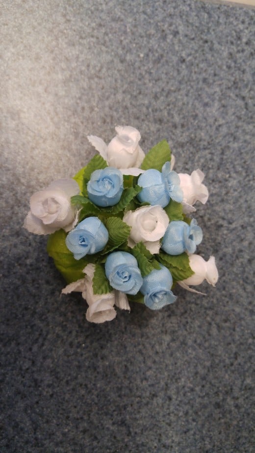 Cut the flower stems short enough to pin into the sponge. I used hot glue gun to secure the stems.