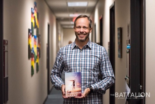Author Ted Boone with his debut sci fi novel, Langford's Leap, hot off the presses. 