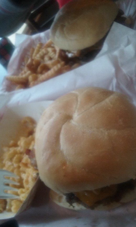 A burger with a side of fries & a burger with a side of mac and cheese at Emma Keys Restaurant on Walker Avenue in Greensboro, North Carolina.