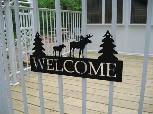 A welcome sign or door mat sets the tone for the visit.
