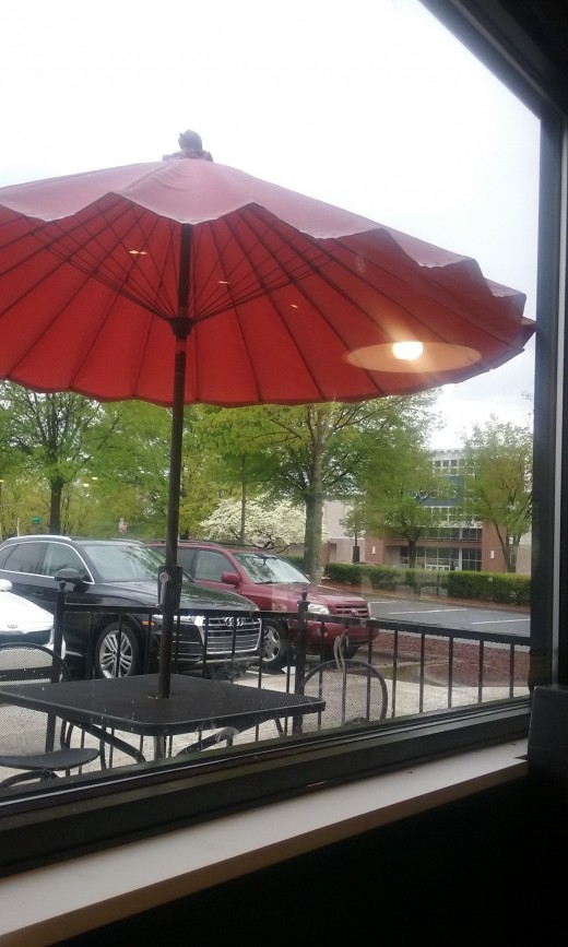 The outdoor seating at Qdoba Grill Restaurant in Greensboro, NC across the street from Sears Department Store.