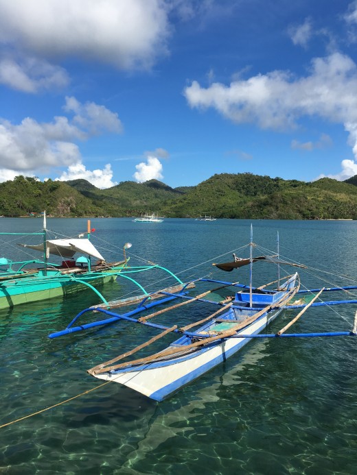A Philippine outrigger ferry guests from the dock to the resort