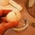 Use a knife to strike the egg halfway between the ends of the shell.