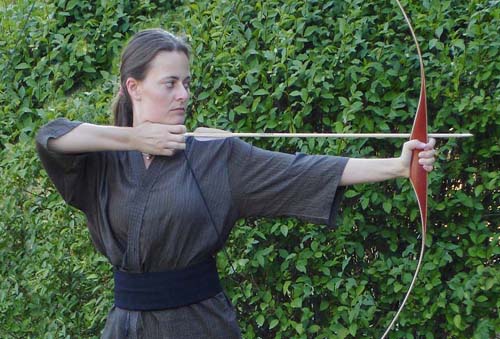 The tangible bow with action of pulling back to release and send the arrow flying through the air.