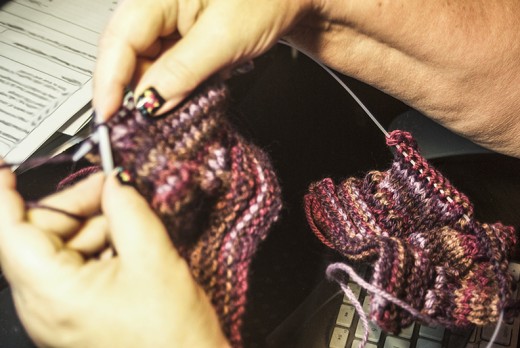Knitting two booties at the same time.
