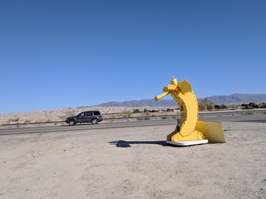 Banana sculpture that sits between the road and Museum