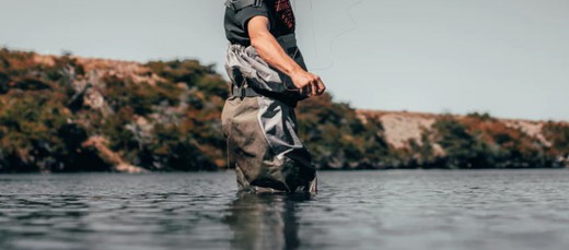 Man wearing a wading suit.