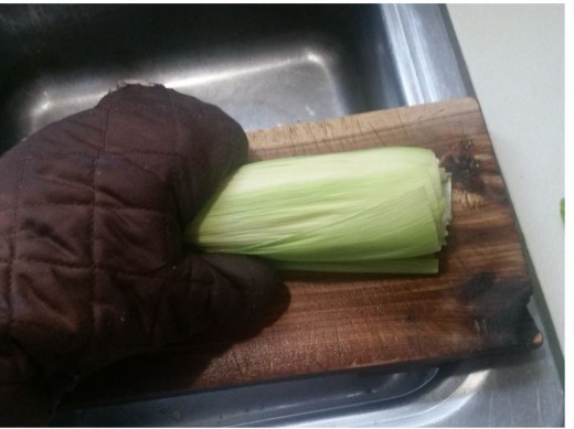 remove from microwave, place on firm surface and grasp with mitt and squeeze corn out of husk