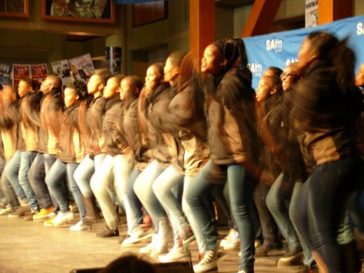 A group of young people singing and dancing at the Annual National Art Festival
