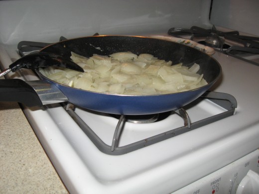 Sauteeing onions on the stovetop.