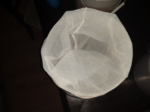 Cheesecloth over sterile food bucket