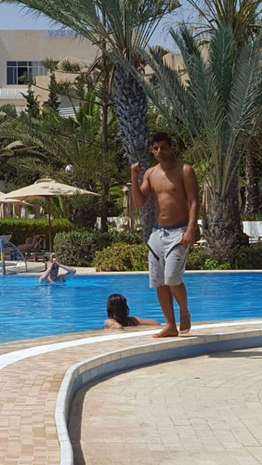 A hotel animator in Hammamet, Tunisia entertaining guest out by the pool 