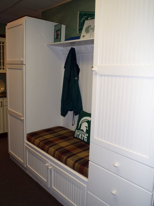 Fall mudroom decor should feel cozy and provide ample storage space for jackets and shoes.