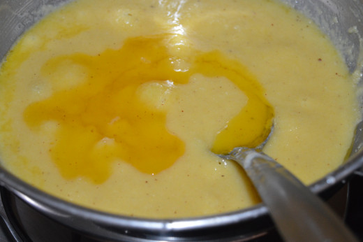 Step four: Add melted ghee little by little while stirring. This way, add all the ghee, continuing the process until the end