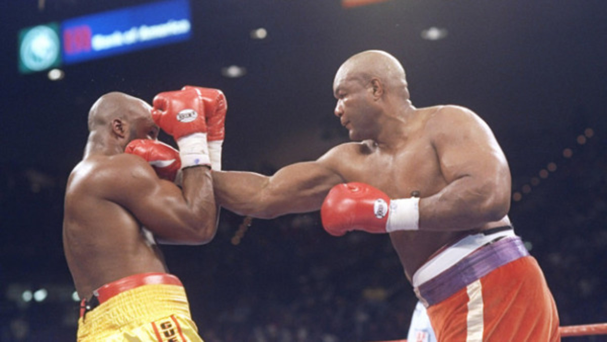 George Foreman lands a punch on Michael Moorer at their 1994 world heavyweight title bout. 45-year old Foreman, an ordained minister since 1978, won his 2nd title after a record 20-year hiatus.