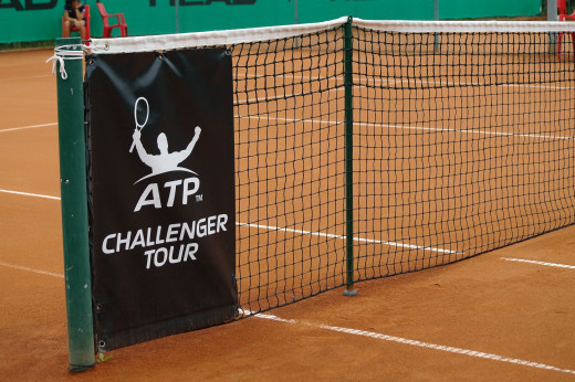 A tennis net setup in center court. 