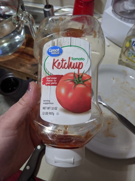 Using up last drops of ketchup in bottle