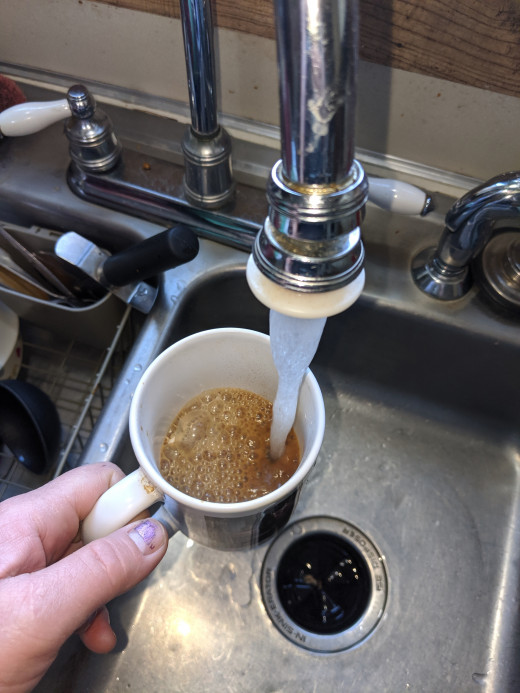 Filling cup with hot water.