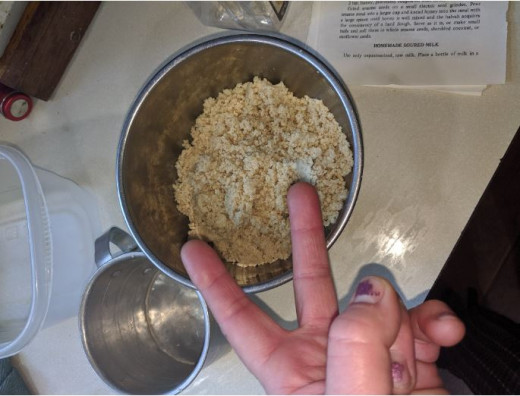 two cups of sesame seeds after being ground