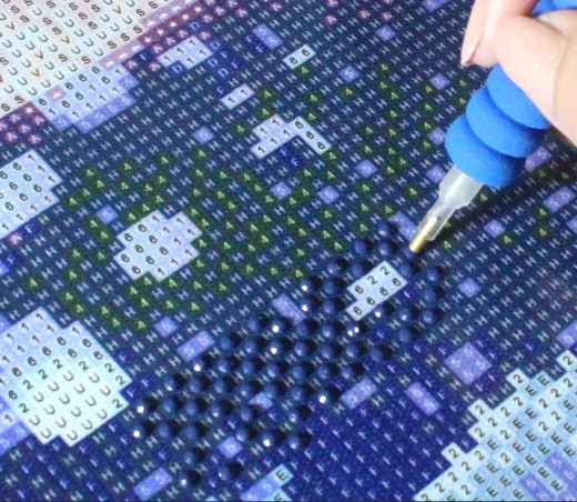 Putting one color of diamond painting rhinestones first that is dominant on a part