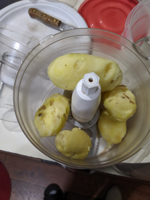 Potatoes in food processor, after peeling