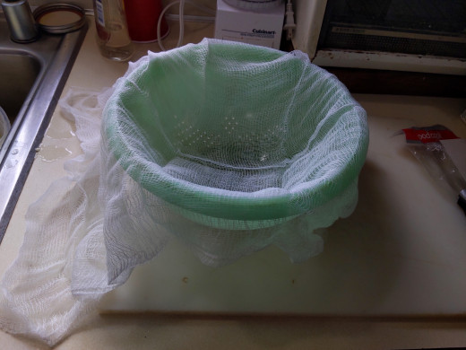 Cheese cloth in collander