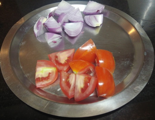 Roughly chop onion and tomato into medium sized cubes. Keep aside.