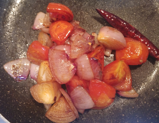 Mix and cook till the tomatoes the mixture is soft and cooked completely. The raw smell of tomato should go away.