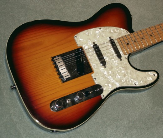 In the 90's, a lot of experimental Teles were produced, looking for a heavier sound than what the 50's and 60's models could deliver. This is the same layout of the currently popular Blackout Tele which features two neck pickups - one in the neck and