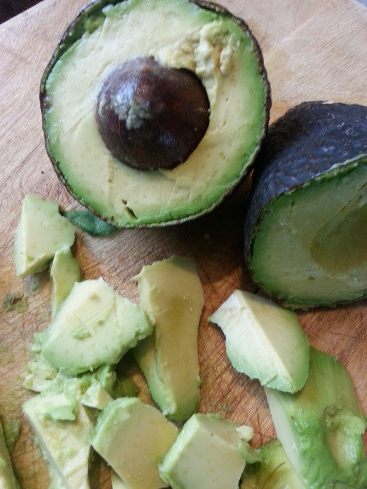 Peel and slice the avocados.