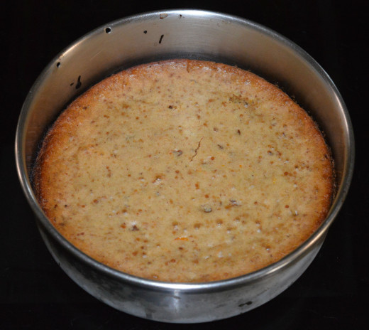 Step four: Bake the cake over medium-high heat for 20 minutes. Check whether it is baked or not by inserting a skewer inside the cake. If the skewer  comes out clean, the cake is baked. Otherwise, bake it for some more time.