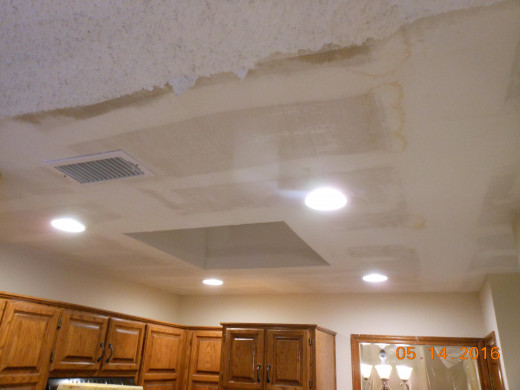 Ceiling water damaged and texture scraped off in order to repair and ready re-blow new texture after it dried out